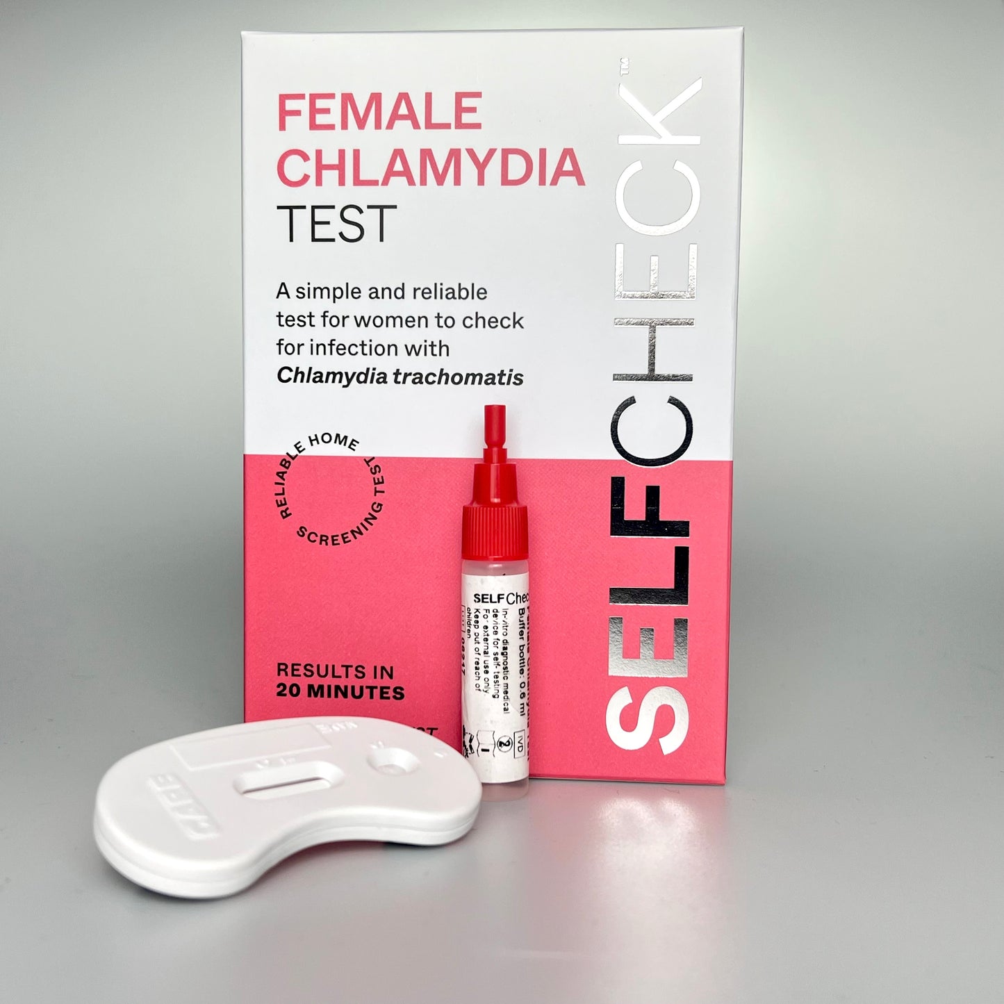 SELFCHECK chlamydia test kit contents showing box, extraction buffer bottle and test cassette