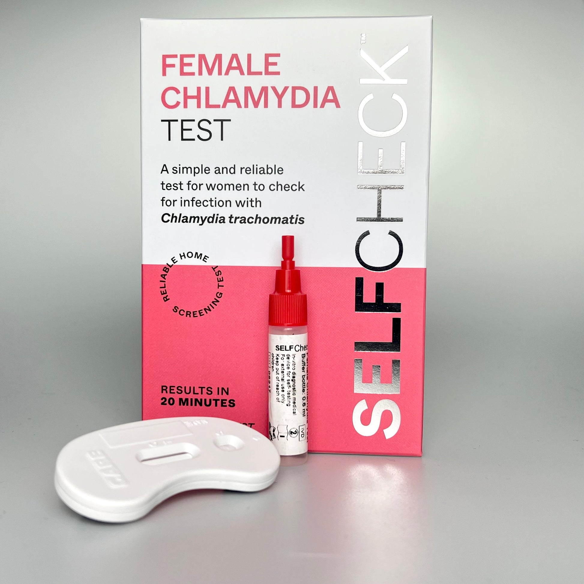 SELFCHECK chlamydia test kit contents showing box, extraction buffer bottle and test cassette