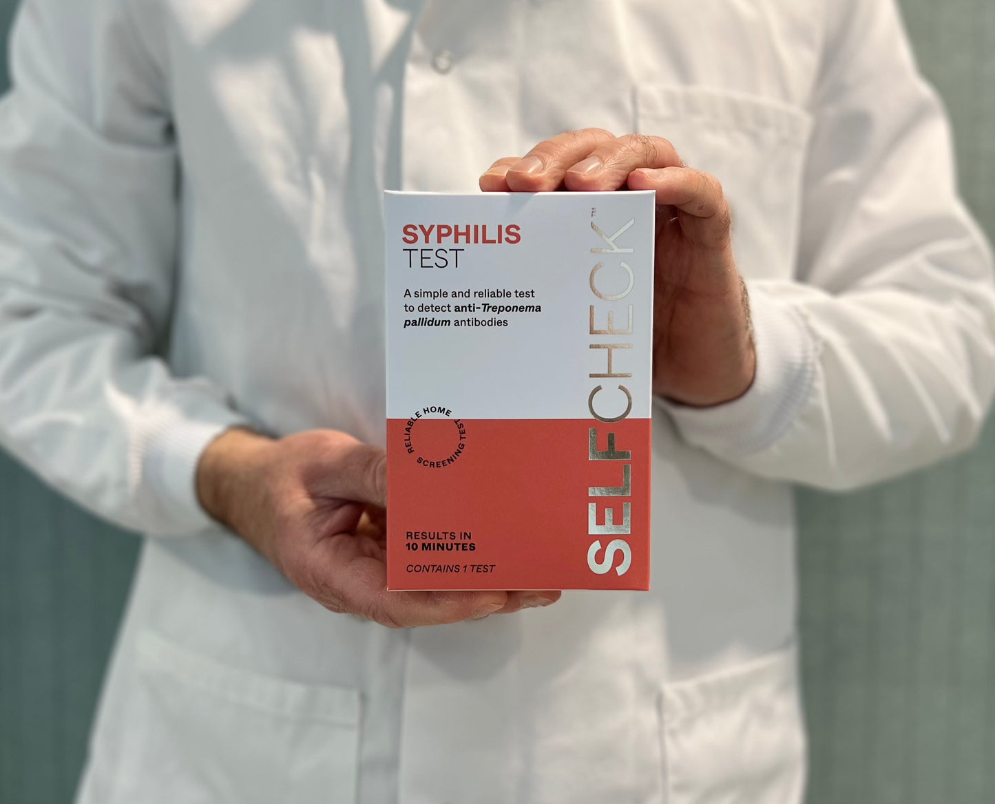 Scientist holding syphilis test from SELFCHECK