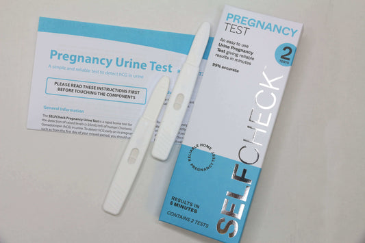 SELFCHECK Pregnancy Test Kit Showing the box, instruction leaflet, and two mid stream urine devices