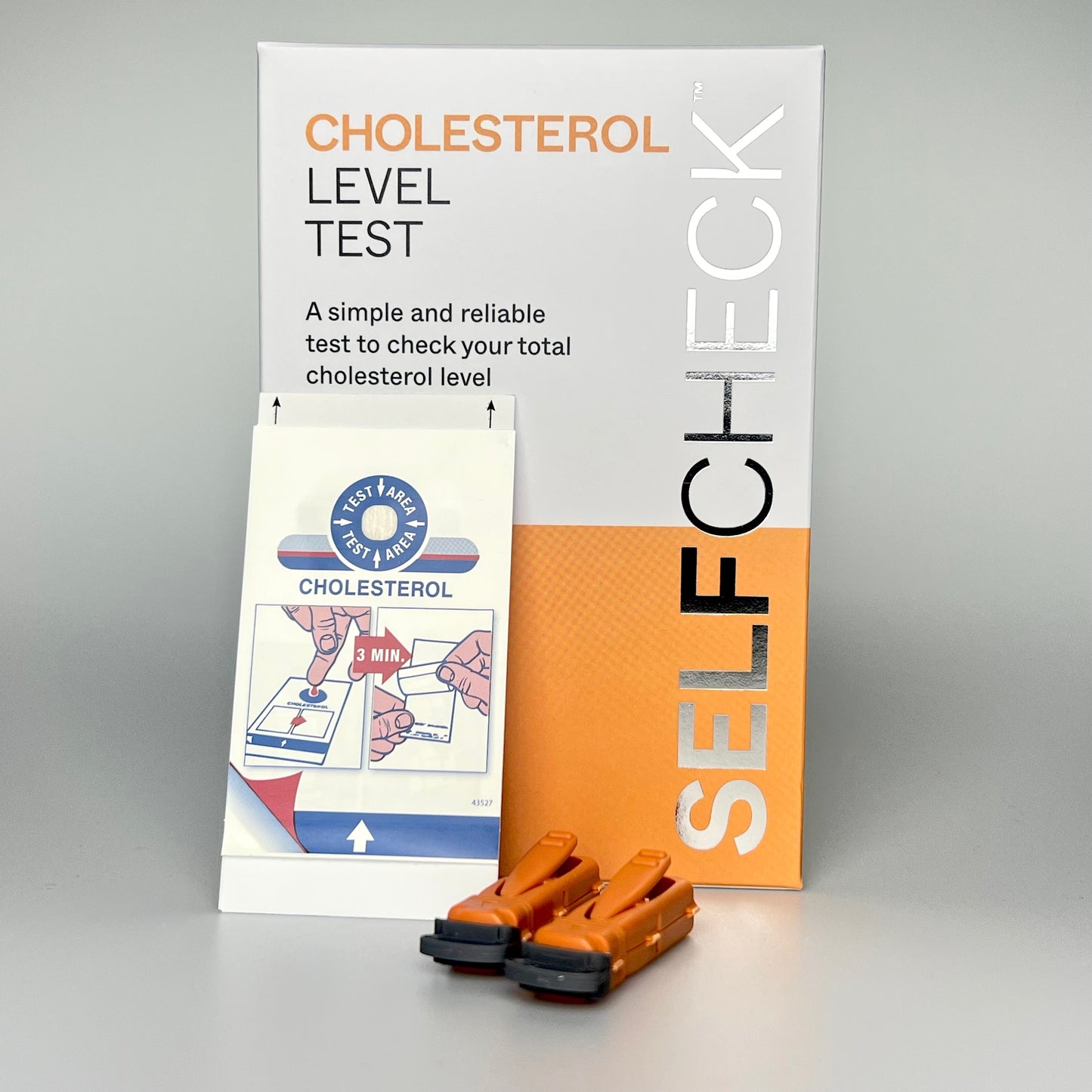 SELFCHECK Cholesterol Test Kit Box, test device and two lancets.