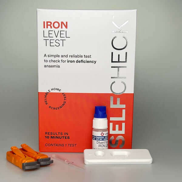 SELFCHECK Iron Deficiency Test Kit Showing two lancets, pipette, diluent bottle and lateral flow test cassette